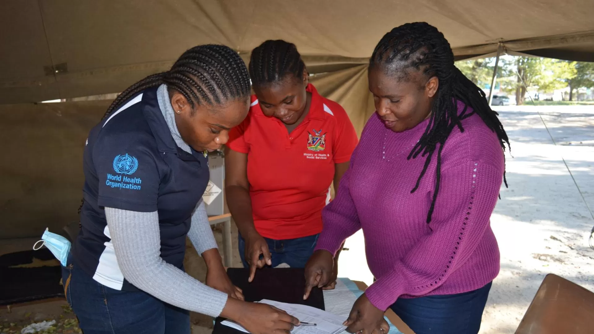 Josephine Poniso and colleagues in the triage tent at the entrance of the hospital