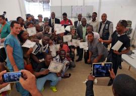 Group of graduates with their certificates from the Ministry of Health and Social Welfare.