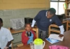 WHO Ethiopia Neglected NTD Coordinator Dr Abate Mulugeta overseeing the deworming in a school in Addis Ababa