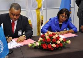 Mr Garry Conille, UNOPS Regional Director for Africa, and Dr Matshidiso Moeti, WHO Regional Director for the African Region, sign MOU on health care delivery in Africa.