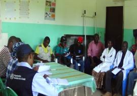 WHO and Ministry of Health staff discussing with nurses