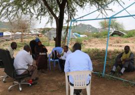 Kifa Bashir (center) in a discussion with the community leaders in Babile Woreda. Photo: WHO/Tseday Zerayacob