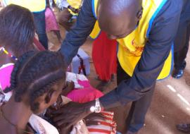 State MoH Director General administering polio vaccine