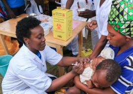 The Minister of Health, Dr Diane Gashumba, providing Measles and Rubella Vaccine