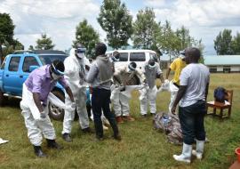 Health workers don their Personal protective Equipment 