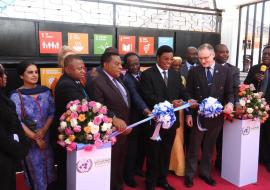 Hon. Kassim M. Maliwa (MP), the Prime Minister of the United Republic of Tanzania cutting the ribbon to mark the launch of the new UN Dodoma Office. To his right is the WHO Representative, Dr. Matthieu Kamwa, Hon. Amb. Dr. Augustine Mahiga (MP), Minister for Foreign Affairs and East African Cooperation, to his left is Mr. Alvaro Rodriguez, the UN Resident Coordinator holding the ribbon. Standing to the far left and right are government officials and Heads of UN Agencies.