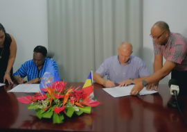 Dr Teniin Gakuruh, acting WHO Liaison Officer and Honorable Jean Paul Adam, Minister of Health signs the framework  