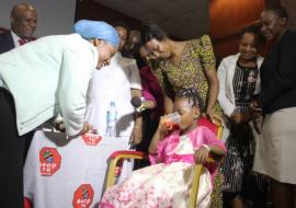 Minister for Health, Hon. Ummy Mwalimu, witnessing a child taking the new child-friendly TB medicine