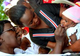 A health worker administers the Rotavirus vaccine to a baby in Buikwe District 