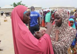 Health Worker administering Oral Cholera Vaccine to people in the Maiduguri Metropolitan Council, Maiduguri.