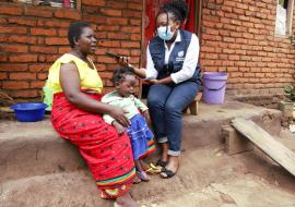 Clara Magalasi, from rural Lilongwe, Malawi, walked 4 kilometers to ensure her daughter Grace, age 22 months, received her 4th and final dose of the malaria vaccine – the 4-dose regimen provides optimal malaria prevention benefits as a complementary malaria control tool.