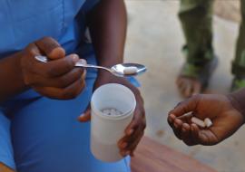 Child receiving her deworming medication during the campaign 