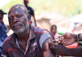 Namita proudly receives his first Covid-19 Vaccine dose