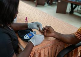 A blood glucose test measuring the amount of glucose in a sample blood