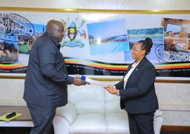 Dr Kasonde Mwinga, the newly appointed WHO Country Representative to Uganda, presenting her credentials to the Minister of State for Foreign Affairs, Hon. Henry Oryem Okello