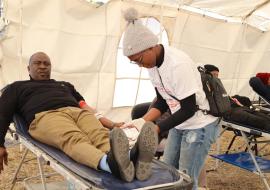 Lesothos Honorable Minister of Health, Mr. Selibe Mochoboroane leads by example by donating blood during the national World Blood Donor day commemoration