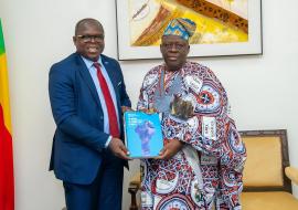 Dr. Kouamé Jean Konan, WHO Representative in Benin, presenting the WHO Benin Country Cooperation Strategy 2023–2027 to His Excellency Louis Gbèhounou Vlavonou, President of the National Assembly.