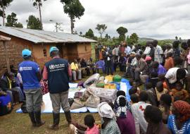 WHO Staff members conducting a community engagement activity during the Marburg Virus Disease outbreak