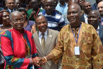 Shaking hands: NTDs Ambassador Evelyne Kandakai (in red) and Hon Johnson Toe Chea (right), Dr Francis Kateh (middle) 