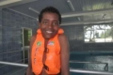 Muaz Reshid with a radiant smile at the hydrotherapy facility.