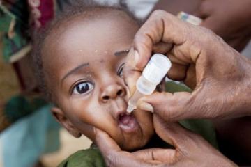 An eligible child receiving oral polio vaccine in Maiduguri, Borno state
