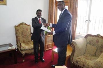 Honorable Minister of Foreign Affairs and International Cooperation, Mr Ephraim Chiume (left) receiving Dr. Eugene Nyarko’s credential at the Minister’s Office, Capital Hill