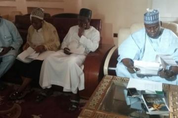Adamawa State Deputy Governor reading the TOR at the inaugural meeting of the TFI