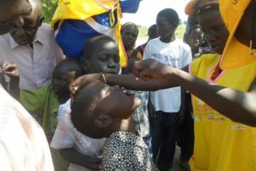 A child getting vaccine in the special vaccination post in Unity