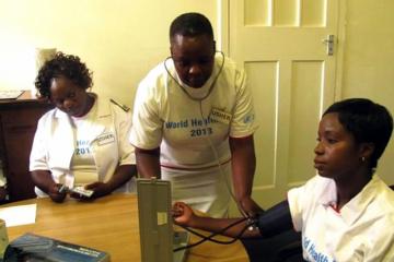 One of the participants getting her blood pressure checked in one of the screening booths