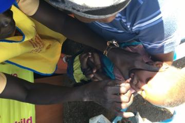 A child being vaccinated against polio in Juba