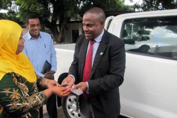 Dr. Martins Ovberedjo on behalf of WHO, handing over keys for the vehicle to the Minister for Regional Administration and Local Government (PMORALG), Hon. Hawa Ghasia (MP)