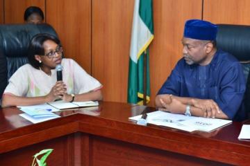 Dr Moeti speaking with Nigeria's Minister for Budget & Planning