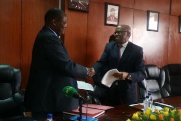 Dr. Jacob Mufunda, WHO Representative (left ) and Mr. Damoni Kitabire, Resident Representative, African Development Bank at the signing ceremony