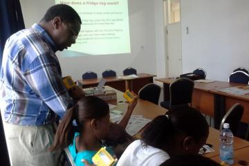 WHO Consultant, Dr Chindedza trains EPI nurses on the use of the Fridge Tag for vaccine temperature monitorin