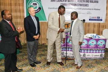Dr Eugene Nyarko, WR Malawi shaking hands with the Minister of Health, Honorable Dr Peter Kumpalume, MP
