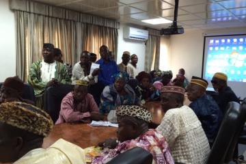 Traditional leaders in a meeting with Liberian authorities and representatives of WHO