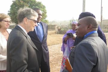 Dr Idowu (right) explaining the rationale for environmental surveillance to Mr Gates while Alhaji Dangote listened