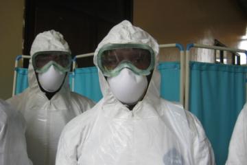Healthcare workers in personal protective garbs provided by WHO