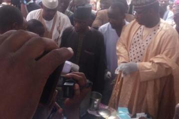 Sokoto Commissioner for Health (1st right) preparing to vaccinate a child at the flag-off
