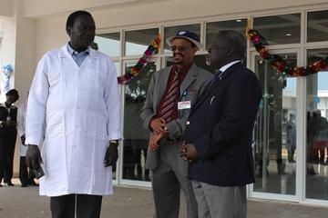 Hon Minister of Health Dr Riek Gai Kok, Dr Abdi Mohamed and Dr Makur Kariom, Undersecretary Ministry of Health at the Rumbek Maternity Hospital entrance