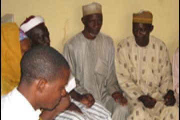 Participants in a town hall meeting discuss immunization in their community.