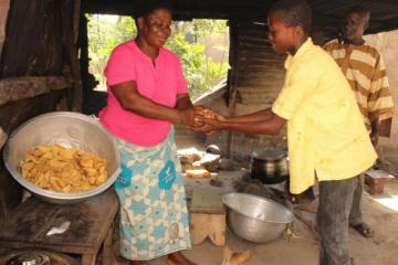 Madam Kamazoue Abatan, food vendor. She is a beneficiary of early diagnosis and prompt treatment.
