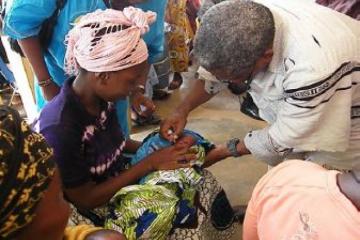 Deputy Minister administering the vaccine