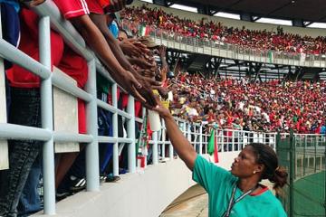 Disinfecting spectators’ hands with hand sanitizing gel at the Africa Cup of Nations, Equatorial Guinea, 2015 WHO/Nicolas Isla