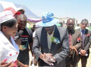 Honorable Minister of Health and Child Care Dr David Parirenyatwa demonstrating the 10 steps of proper handwashing