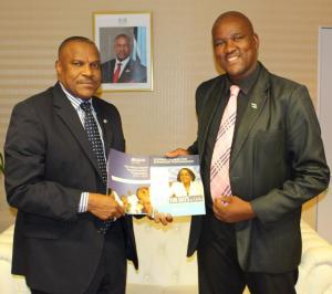 Hon Dr Alfred Madigele, new Minister of Health and Wellness (left) receiving documents from Dr M Ovberedjo, WHO Representative