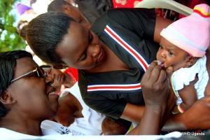 A health worker administers the Rotavirus vaccine to a baby in Buikwe District 