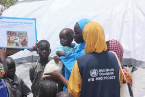 WHO personnel raising awareness on proper hygiene and prevention against cholera