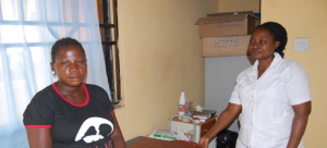 (Seated) Mrs Naomi Muyadeen and Head Nurse Esther Adepoju, Kuchigoro Primary Health Care Centre, Abuja.