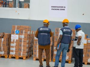 WHO Liberia staff inspecting consignment together with Central Medical Stores staff